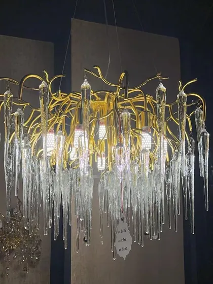 An artistic chandelier with icicle-like glass elements. This fixture creates a stunning visual, especially suited for modern and minimalist interiors that need a touch of drama.