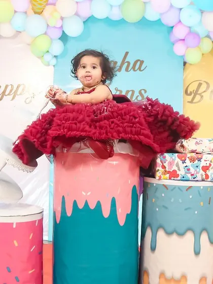 A magical 'Frozen 2' themed birthday party, transforming the venue into an enchanted forest with earthy tones, character cutouts, and shimmering backdrops.