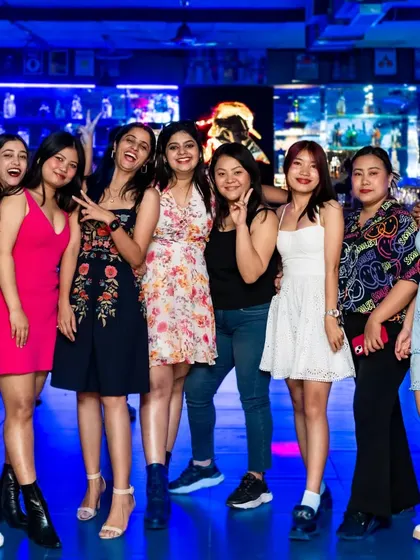 The whole crew is here for a night of fun. I love seeing groups like this enjoying the music, drinks, and overall vibe.