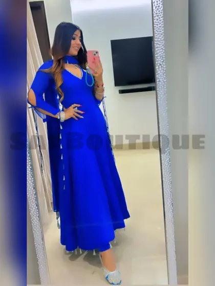 A full-length mirror selfie of the client in her royal blue Anarkali. The flowing silhouette and vibrant color make it a stunning choice.