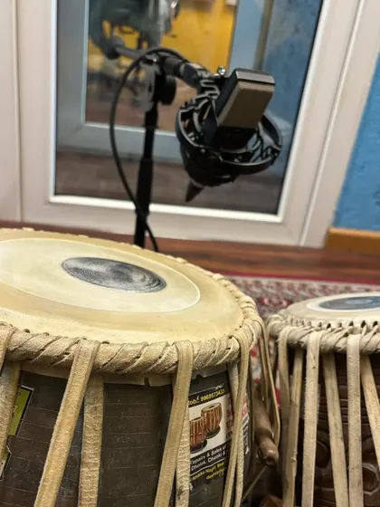 A close-up of my tabla and dholak setup in the studio. Depending on the song's requirement, I use different percussion instruments to provide a range of textures and grooves.