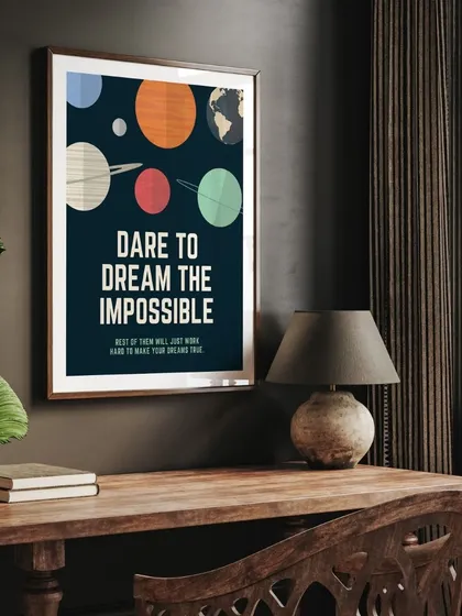 The "Dare to Dream the Impossible" print in a classic frame, placed on a desk. It's a daily reminder to think big and chase your most ambitious goals.