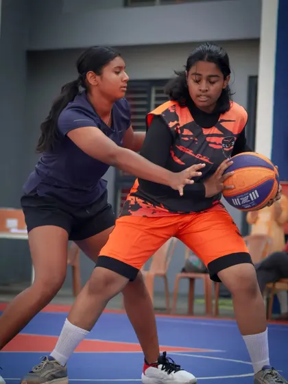 A strong defensive stance is crucial to the game. Here, one player guards another closely, demonstrating the defensive principles I teach.