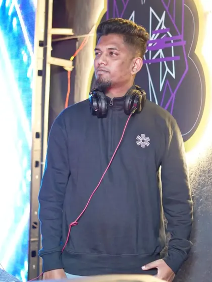 A focused look while at the DJ booth. This captures my dedication to the craft and the music.