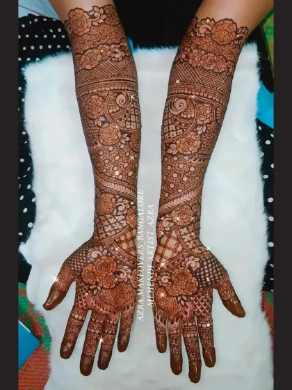This full arm bridal design is perfect for the bride who loves roses, featuring them prominently from hand to elbow.