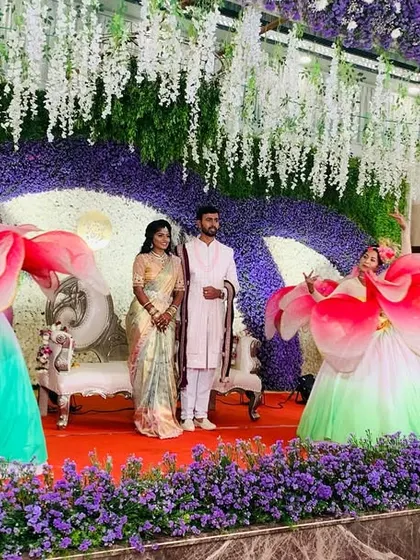 We make your couple's entry the main event. Here, our signature Lotus Entry creates a breathtaking pathway for the bride and groom, framed by our dancers in magnificent blooming lotus costumes.