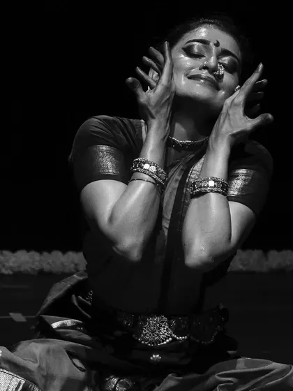 A black and white still from *KANHOPATRA*, highlighting the intense emotion of the character. The stark contrast emphasizes the dramatic nature of her story and her powerful poetry.