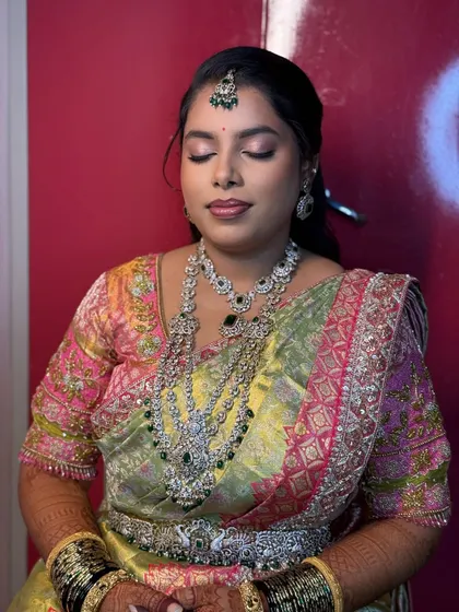 With her eyes closed, you can see the delicate shimmer and beautiful blend of the eyeshadow for her reception look.
