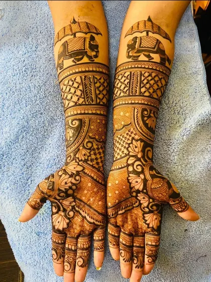 A clear shot of a popular bridal design featuring elephants with howdahs. The combination of figurative work with geometric patterns is a signature of my style.