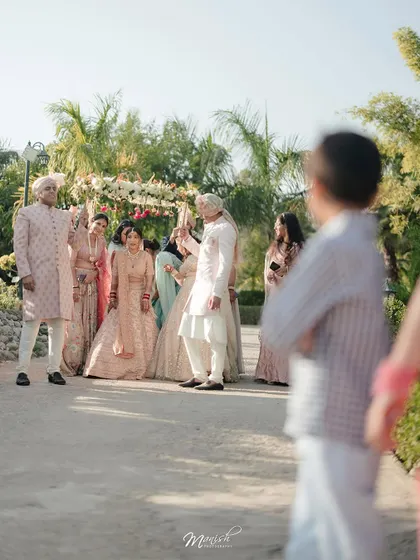 A candid, documentary-style shot of the wedding ceremony, capturing the event from a unique and personal perspective.