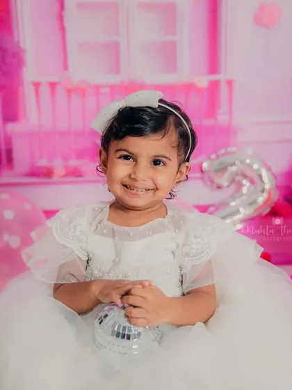 That smile says it all. She had so much fun during her Barbie-themed second birthday photoshoot.