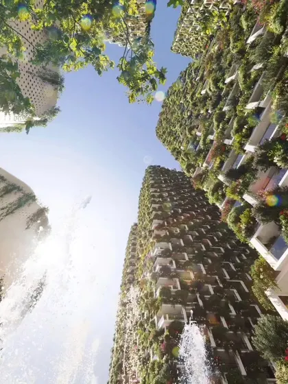 A dramatic upward view of the Sky Gardens towers, with a fountain in the foreground, capturing the project's blend of natural elements and ambitious architecture.
