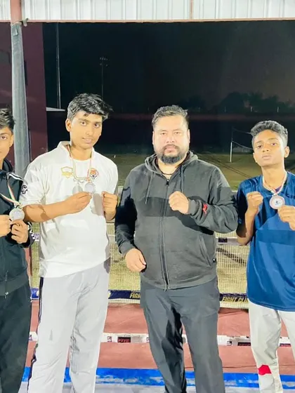 Standing with our champions. As a coach, their victory is my reward.