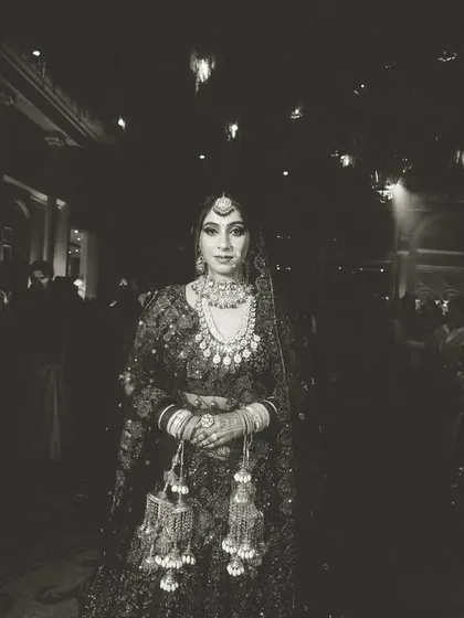 The same grand bridal entry, captured in a timeless black and white edit, emphasizing the drama of the moment.