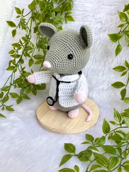 Dr. Mouse! This was a custom order for a graduation gift. The mouse is dressed in a doctor's apron with a tiny stethoscope and comes on a wooden base to be a display piece.