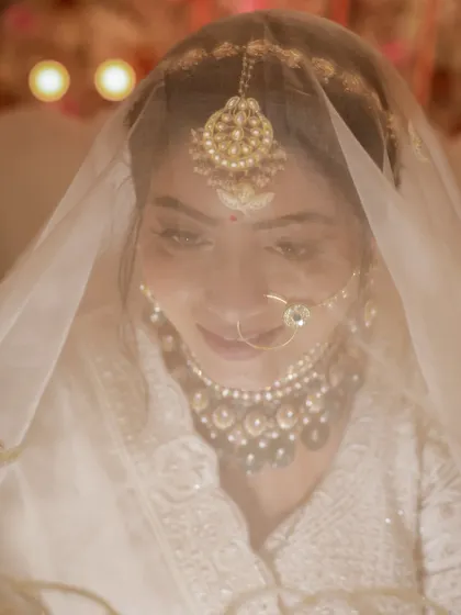 A soft and gentle smile from the bride, captured through her veil. These are the subtle, beautiful moments we love.