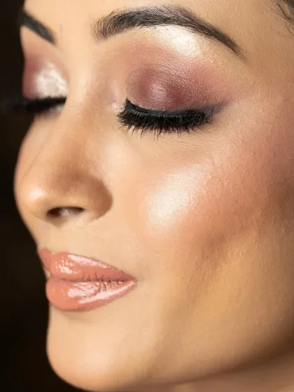 A close-up of the glossy lip and glowing skin from our masterclass look.