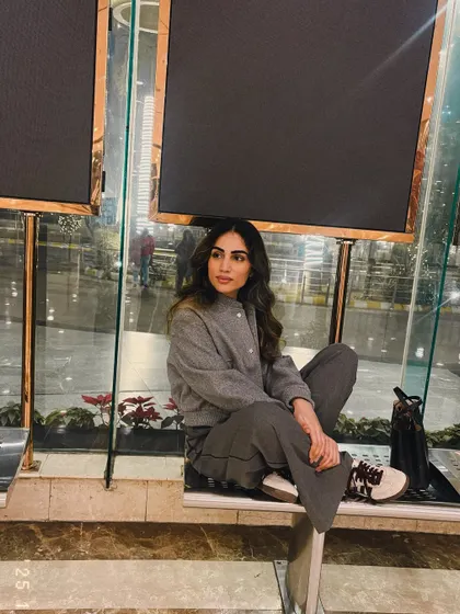Winter evenings. A shot of me in a grey co-ord set, enjoying a quiet moment.
