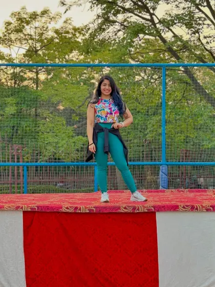 Just me, on stage, living my best life. Hosting fitness events for everyone is a joy. The collective happiness and confidence boost in the participants makes it all worth it.