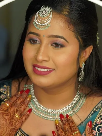 One of my favorite bridal looks. The combination of a colorful eye, bold lip, and intricate jewelry makes for a stunning reception statement.