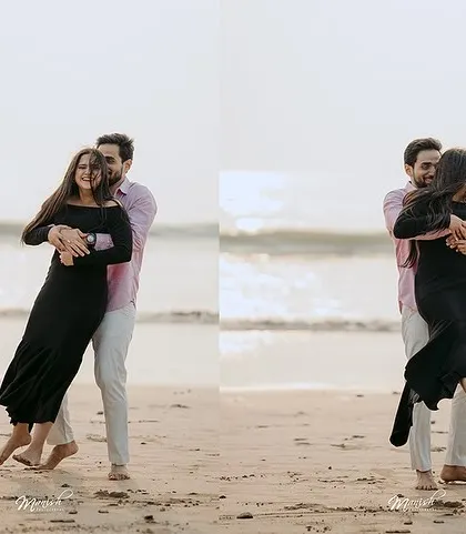 A playful lift on the beach, capturing a moment of pure fun and affection against the backdrop of the sea.