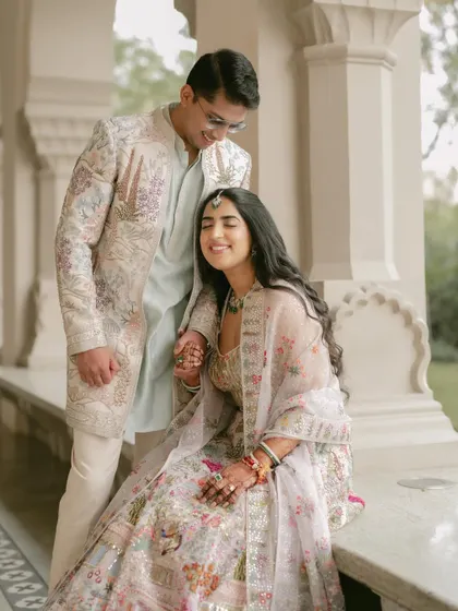 A moment of quiet affection. The groom's gentle touch and the bride's happy smile create a portrait filled with warmth.