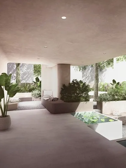 The ground floor of The Nest was designed as a public landscape for the neighborhood. This semi-open lobby space features planters, water bodies, and informal seating, blurring the line between the building and its surroundings.