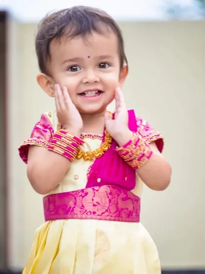 Such a happy smile! The outfit is designed to be comfortable, using soft lining under the silk so that children feel happy and can be themselves while wearing my creations.