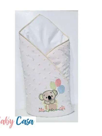 This whimsical wrap features an embroidered koala holding balloons. The soft, dotted fabric and cheerful design make it a fun and unique addition to any baby's collection.