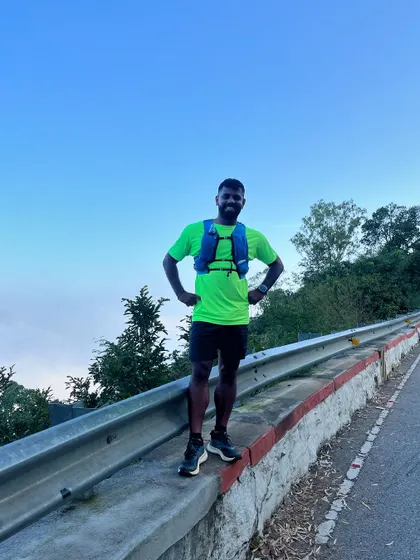 A moment of peace at Nandi Hills during a training run, with the clouds below me.