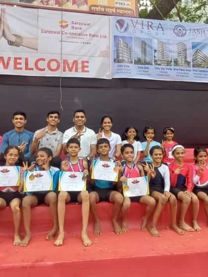 The victorious team. Our young athletes and coaches pose with their well-earned medals and certificates after a fantastic showing at the local Parle Mahotsav competition.