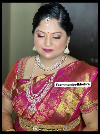 A close-up of this bride's Varapooje makeup. I used shimmering pink eyeshadow and a bold magenta lip to complement her saree and diamond jewellery, creating a look that is both traditional and glamorous.