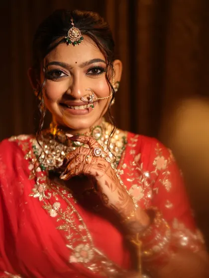 A bright, happy close-up of the bride, her smile lighting up the photo.