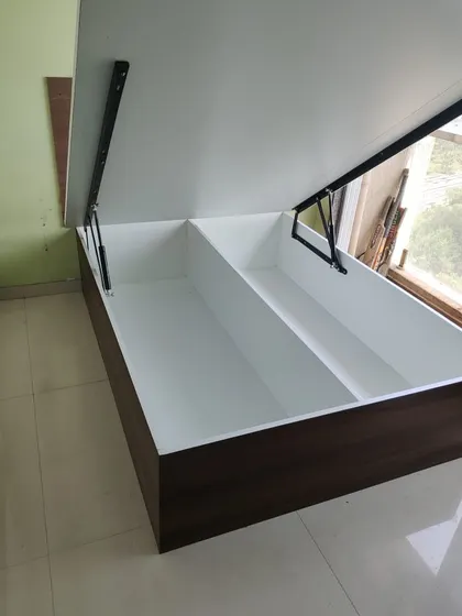This image shows the hydraulic storage inside the bed that accompanies the wardrobe, demonstrating a complete bedroom storage solution.