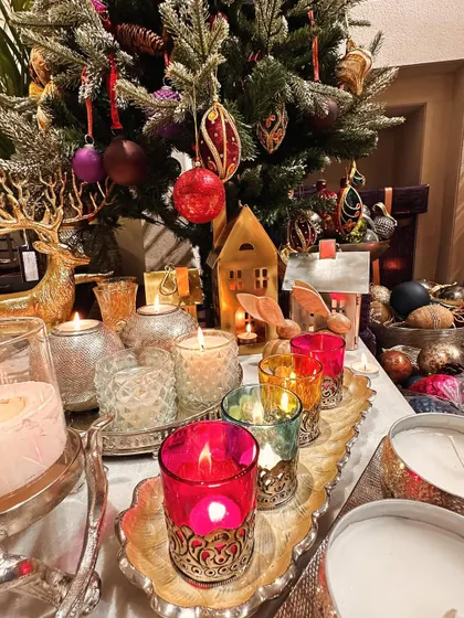 Another view of our colourful Christmas votives, creating a beautiful, warm display on a scalloped silver tray.