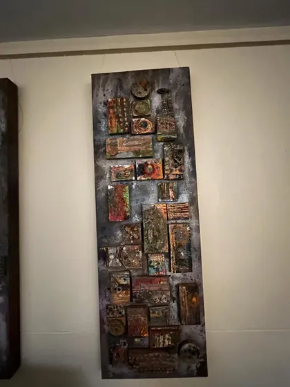 This is an abstract mixed-media piece with a rustic, industrial feel. I used various materials to build up layers of texture, creating a complex and serene artwork that invites closer inspection.