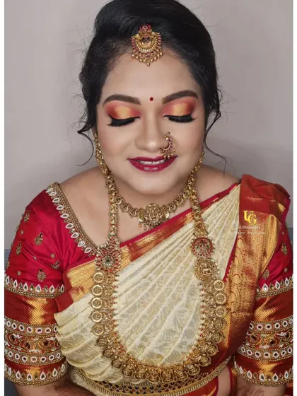 A gorgeous muhurtham look for a client who loves color. You'll learn how to blend vibrant eyeshadows and pair them with traditional jewelry for a complete and festive bridal appearance.