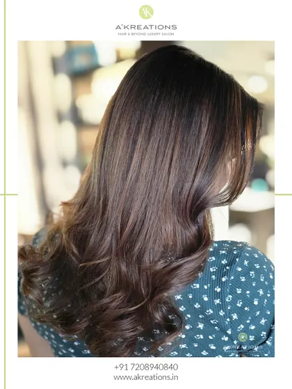 A side view of our cinnamon balayage, showing how the warm tones beautifully complement the client's base color.