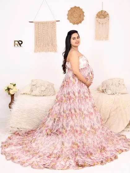 Soft and romantic. This beautiful floral gown is perfect for a bohemian or rustic-themed shoot. The neutral, cozy setup with macrame wall hangings completes the look.