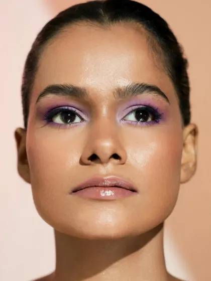 Luminous and fresh. This look by Swastika shows how to make lilac pop on deeper skin tones, all while maintaining a beautiful, dewy finish.