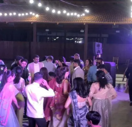 The dance floor is full of guests enjoying the unique music mix.