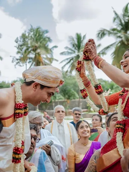 A candid moment of pure joy and affection during the wedding ceremony. It's these unposed, genuine interactions that truly tell the story of your love.