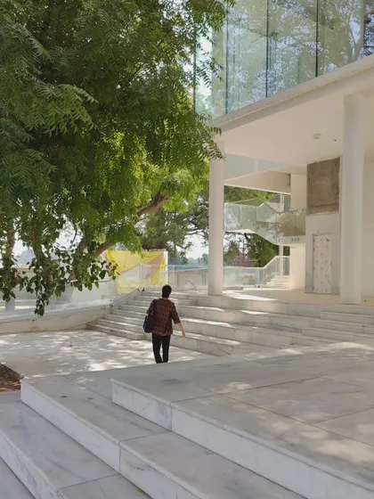 Glimpses of our ongoing project for the Koba Jain Museum. The pristine white structure is lifted on stilts and nestled among existing trees, creating a serene pavilion that invites community interaction and feels light upon the earth.