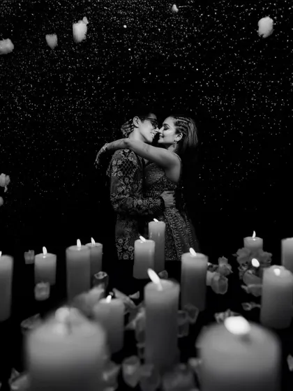 A classic black and white portrait, using the soft glow of countless candles to create a magical and timeless sangeet night memory. This is an example of my fine art photography style.