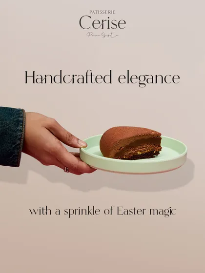 This image captures a moment of quiet indulgence. My handcrafted chocolate entremet, held delicately, brings a sprinkle of Easter magic to your celebration.