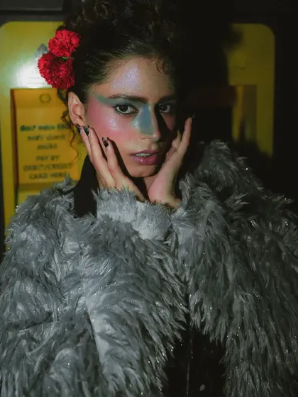 A portrait from 'Lampione' that conveys a sense of vulnerability amidst the bold styling.