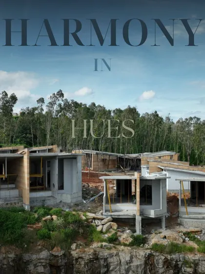 Harmony in Hues. During construction, the soft tones of the raw concrete and wood blend beautifully with the forested backdrop.