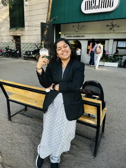 Taking a quick break outside a cafe. While the work is serious, I believe in the importance of finding moments to relax and recharge.