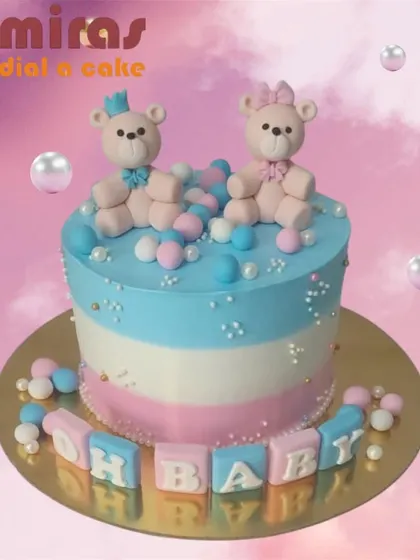 "Oh Baby!" This adorable gender reveal cake features pink and blue teddy bears on a striped cake, surrounded by colorful spheres. It's a sweet way to build anticipation for the big news.