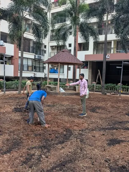 I am on-site, directing the team during the soil preparation phase to ensure the levels are correct across the large area.